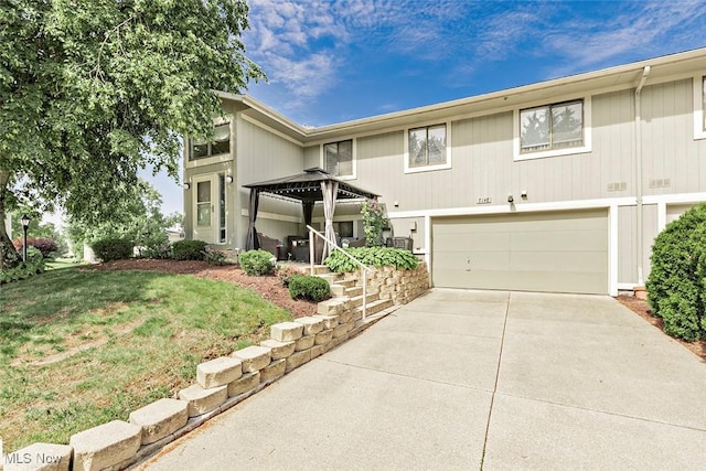 7148 N Brewster Pl, Concord, OH 44077 - view of front of property with an attached garage, concrete driveway, and a front lawn