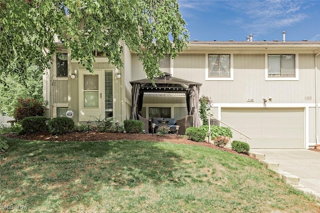 7148 N Brewster Pl, Concord, OH 44077 - view of front of home with an attached garage, driveway, a gazebo, and a front yard