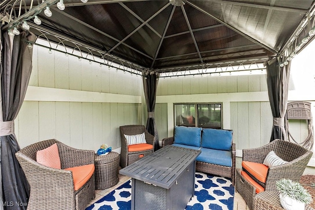 7148 N Brewster Pl, Concord, OH 44077 - wooden deck featuring an outdoor hangout area, a gazebo, and a patio