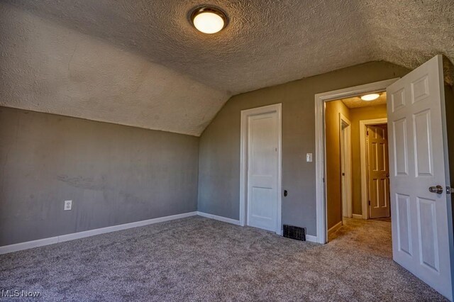 2613 Oakdale Ave, Lorain, OH 44055 - additional living space with a textured ceiling, carpet flooring, and lofted ceiling