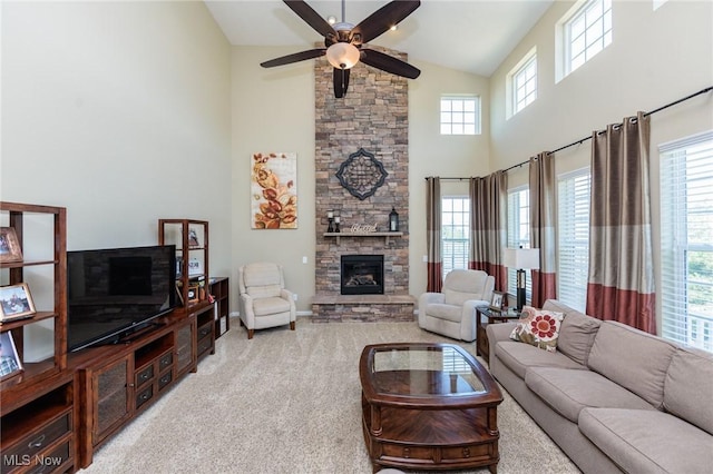 3139 Junior Pkwy, Brunswick, OH 44212 - carpeted living area with high vaulted ceiling, a fireplace, and a ceiling fan