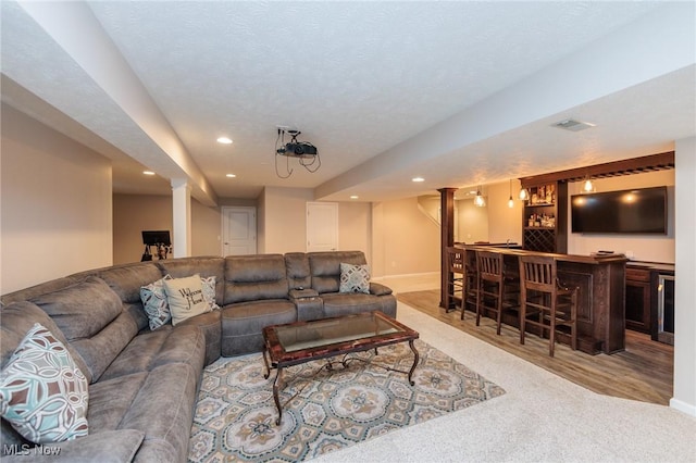 3139 Junior Pkwy, Brunswick, OH 44212 - carpeted living room featuring wet bar, recessed lighting, and decorative columns
