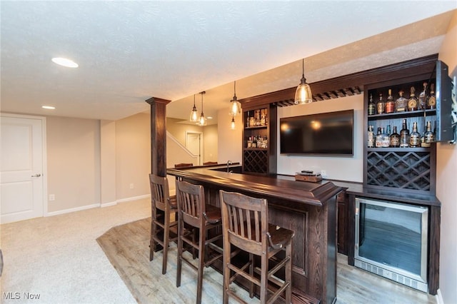 3139 Junior Pkwy, Brunswick, OH 44212 - indoor bar featuring decorative light fixtures, recessed lighting, beverage cooler, decorative columns, and carpet floors