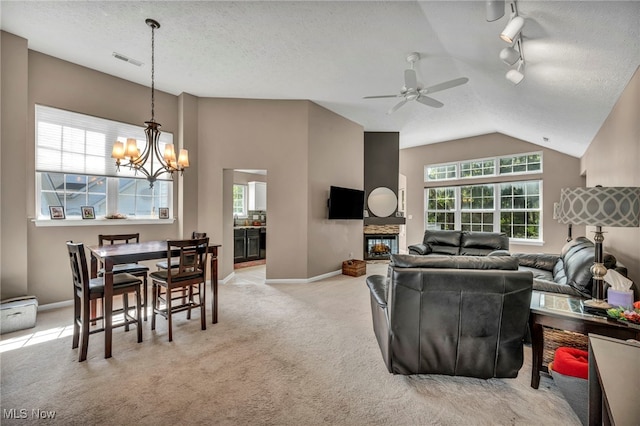 254 Vista Cir, North Olmsted, OH 44070 - living area featuring a chandelier, track lighting, a ceiling fan, light carpet, and a multi sided fireplace