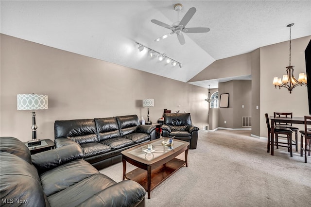 254 Vista Cir, North Olmsted, OH 44070 - living area with a chandelier, lofted ceiling, ceiling fan, light colored carpet, and track lighting