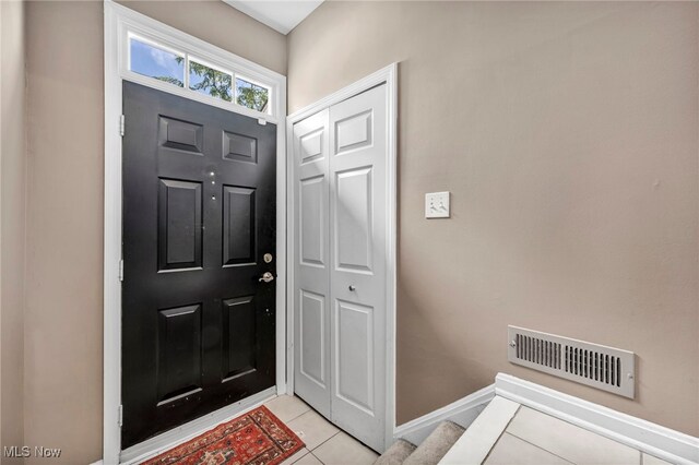 254 Vista Cir, North Olmsted, OH 44070 - foyer with light tile patterned floors and stairs