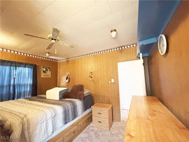 707 Jefferson St, Toronto, OH 43964 - bedroom with wooden walls, carpet, and ceiling fan