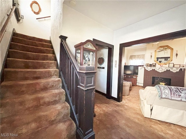 707 Jefferson St, Toronto, OH 43964 - stairs featuring carpet floors and a fireplace