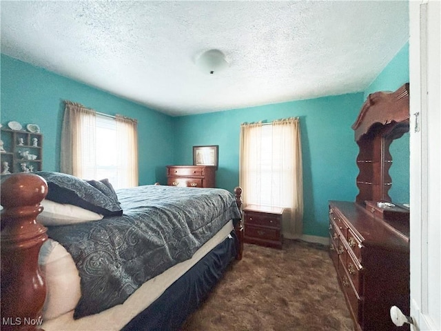707 Jefferson St, Toronto, OH 43964 - bedroom with dark carpet and a textured ceiling