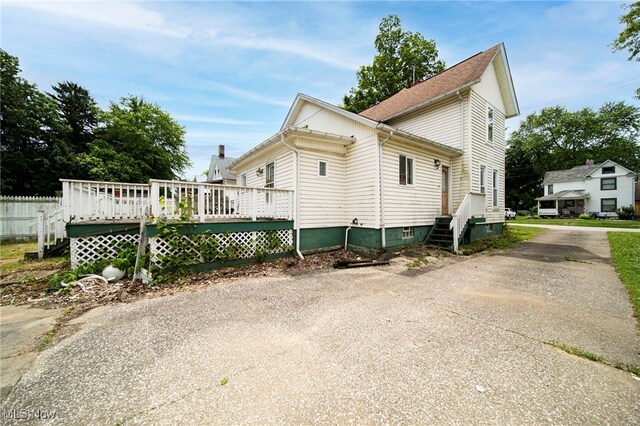 238 Whitney St, Conneaut, OH 44030 - view of home's exterior featuring a wooden deck