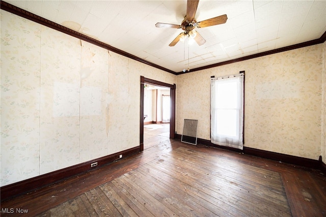 238 Whitney St, Conneaut, OH 44030 - empty room featuring wood-type flooring, ornamental molding, a ceiling fan, and wallpapered walls