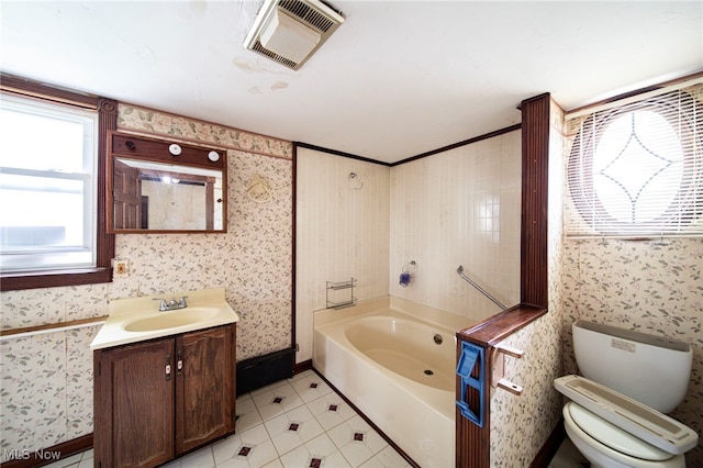 238 Whitney St, Conneaut, OH 44030 - bathroom featuring a garden tub, vanity, tile patterned floors, and wallpapered walls