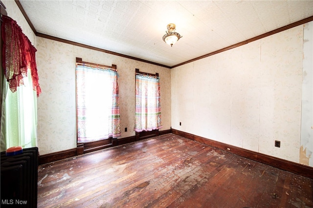 238 Whitney St, Conneaut, OH 44030 - unfurnished room with wood-type flooring, crown molding, and radiator