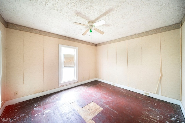 238 Whitney St, Conneaut, OH 44030 - unfurnished room with hardwood / wood-style floors, a textured ceiling, and a ceiling fan