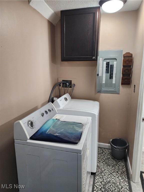 4211 Dennis Ln, Brunswick, OH 44212 - laundry room featuring electric panel, separate washer and dryer, and cabinet space