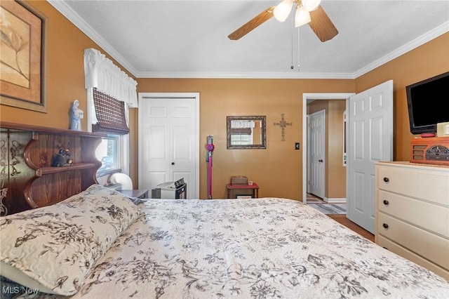 4843 Summer Ln, Brooklyn, OH 44144 - bedroom with ornamental molding, a closet, wood finished floors, and ceiling fan