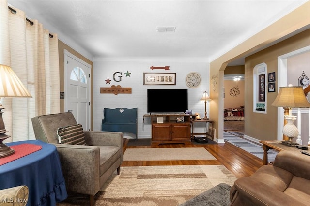 4843 Summer Ln, Brooklyn, OH 44144 - living area with arched walkways and wood finished floors
