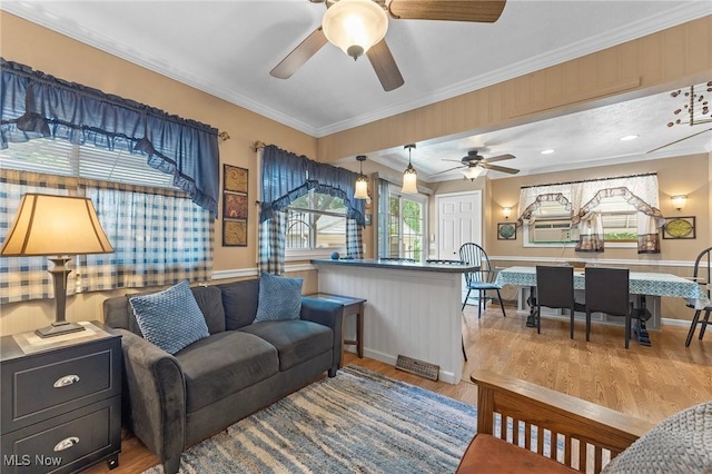 4843 Summer Ln, Brooklyn, OH 44144 - living area with ceiling fan, wood finished floors, and ornamental molding