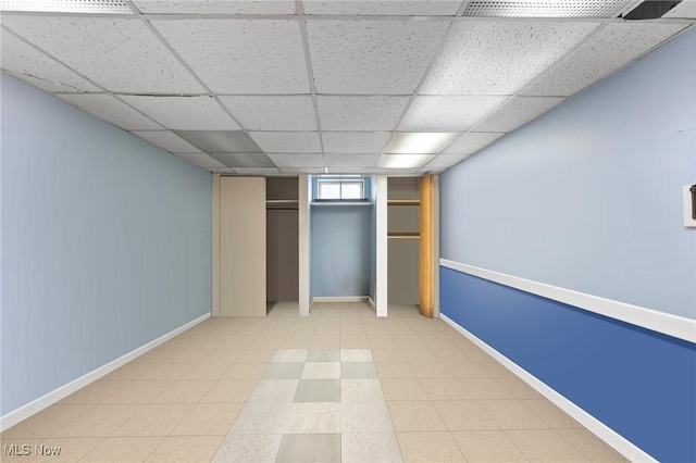 4843 Summer Ln, Brooklyn, OH 44144 - unfurnished bedroom featuring a drop ceiling and baseboards