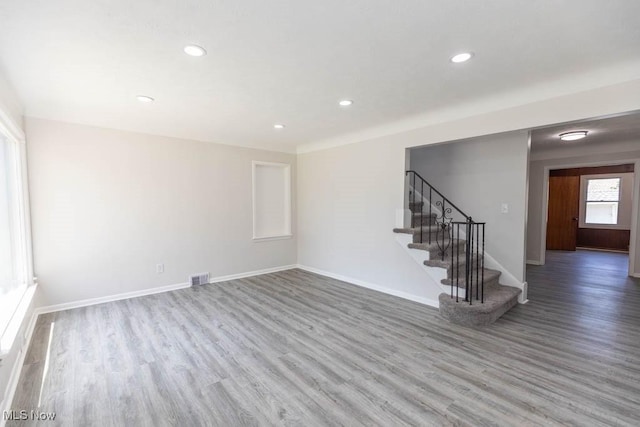 4033 Stonehaven Rd, South Euclid, OH 44121 - unfurnished living room with wood finished floors, stairs, and recessed lighting