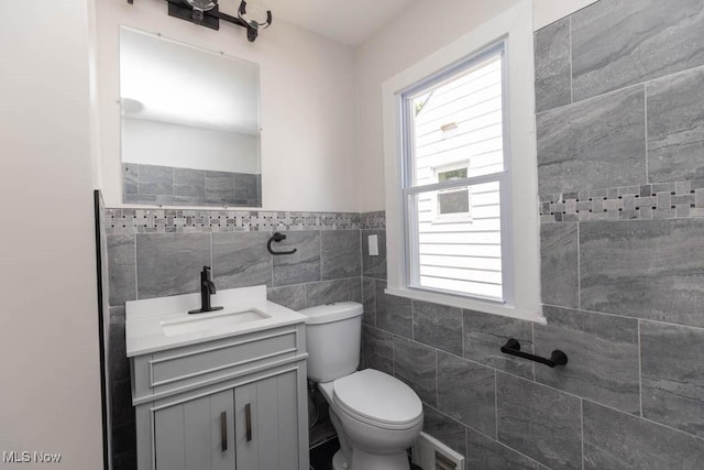 4033 Stonehaven Rd, South Euclid, OH 44121 - bathroom with tile walls, vanity, and a wainscoted wall