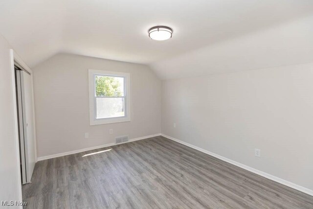 4033 Stonehaven Rd, South Euclid, OH 44121 - additional living space featuring vaulted ceiling and wood finished floors