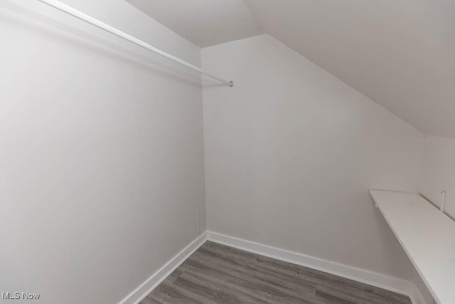 4033 Stonehaven Rd, South Euclid, OH 44121 - spacious closet featuring vaulted ceiling and dark wood finished floors