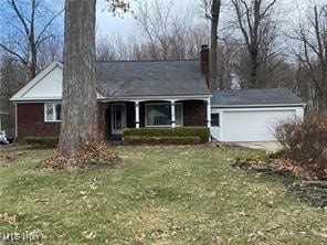 726 Orlo Ln, Boardman, OH 44512 - ranch-style house with a chimney, a front yard, a garage, and covered porch