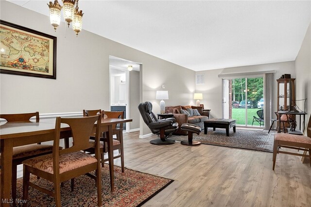 4183 Columbia Rd, North Olmsted, OH 44070 - dining area featuring wood finished floors and a chandelier