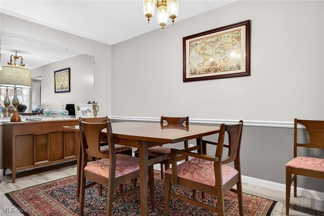 4183 Columbia Rd, North Olmsted, OH 44070 - dining space featuring a chandelier and light wood-style flooring