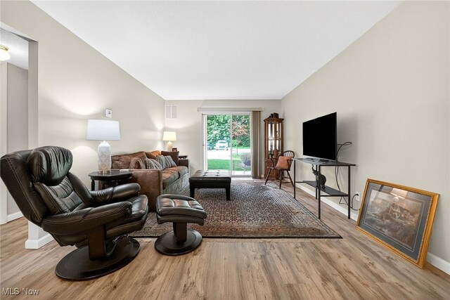 4183 Columbia Rd, North Olmsted, OH 44070 - living area with wood finished floors and vaulted ceiling