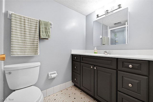 4183 Columbia Rd, North Olmsted, OH 44070 - bathroom featuring vanity, a textured ceiling, and tile patterned flooring