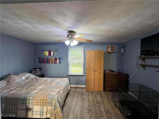 10097 March Rd NE, East Rochester, OH 44625 - bedroom with wood finished floors and a ceiling fan
