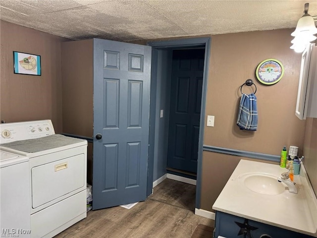 10097 March Rd NE, East Rochester, OH 44625 - washroom with washer and dryer and wood finished floors