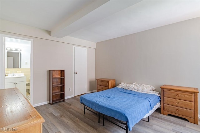 19201 Van Aken Blvd Unit 211, Shaker Heights, OH 44122 - bedroom with light wood-style flooring, beam ceiling, ensuite bathroom, and a closet