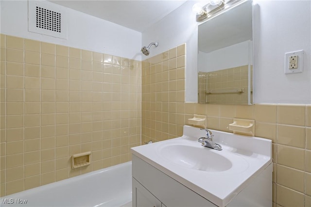 19201 Van Aken Blvd Unit 211, Shaker Heights, OH 44122 - bathroom featuring tile walls, vanity, and shower / bath combination