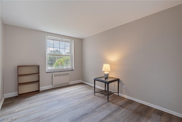 19201 Van Aken Blvd Unit 211, Shaker Heights, OH 44122 - empty room with radiator heating unit and wood finished floors