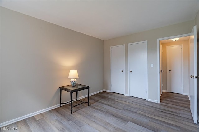 19201 Van Aken Blvd Unit 211, Shaker Heights, OH 44122 - unfurnished bedroom with wood finished floors and baseboards