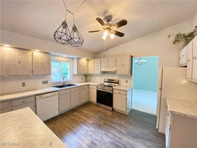 123 Prentiss St, Munroe Falls, OH 44262 - kitchen featuring white appliances, light countertops, lofted ceiling, ceiling fan, and dark wood-style floors