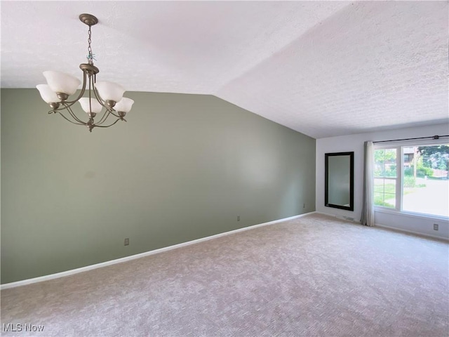 123 Prentiss St, Munroe Falls, OH 44262 - unfurnished room featuring a chandelier, carpet, vaulted ceiling, and a textured ceiling