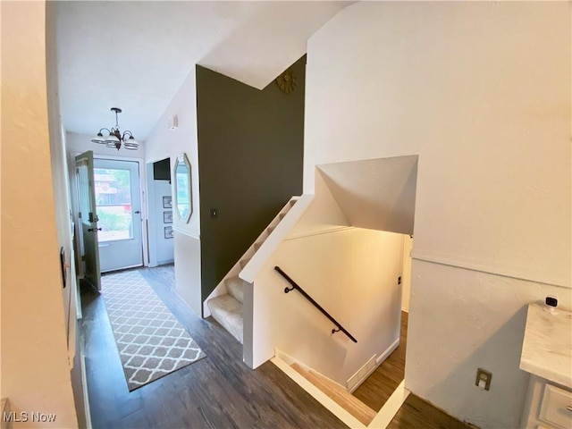 123 Prentiss St, Munroe Falls, OH 44262 - staircase with a chandelier, wood finished floors, and lofted ceiling