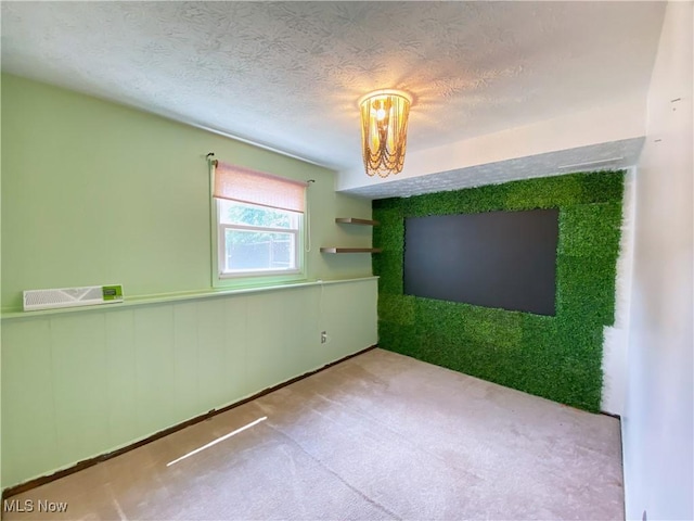 123 Prentiss St, Munroe Falls, OH 44262 - unfurnished room featuring carpet flooring, a textured ceiling, and a wainscoted wall
