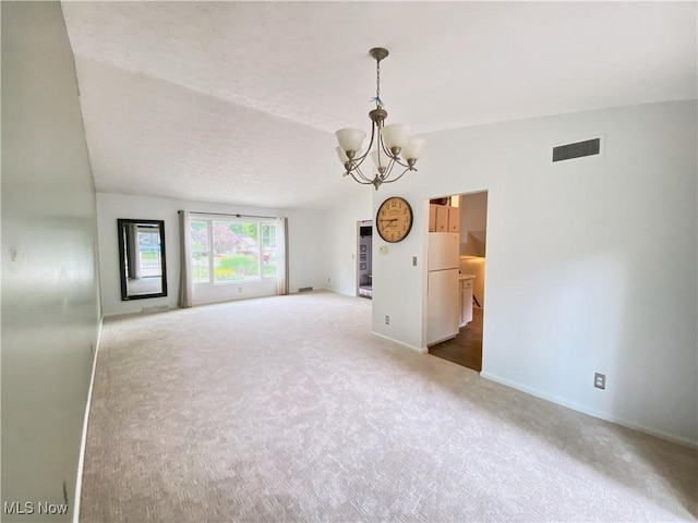123 Prentiss St, Munroe Falls, OH 44262 - carpeted empty room featuring a chandelier and baseboards