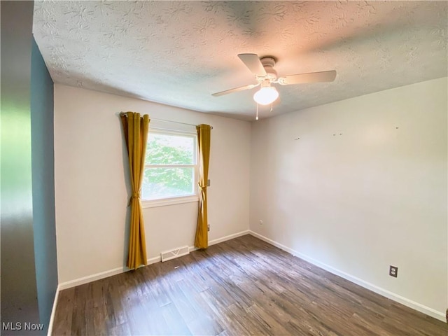 123 Prentiss St, Munroe Falls, OH 44262 - empty room with wood finished floors, a ceiling fan, and a textured ceiling