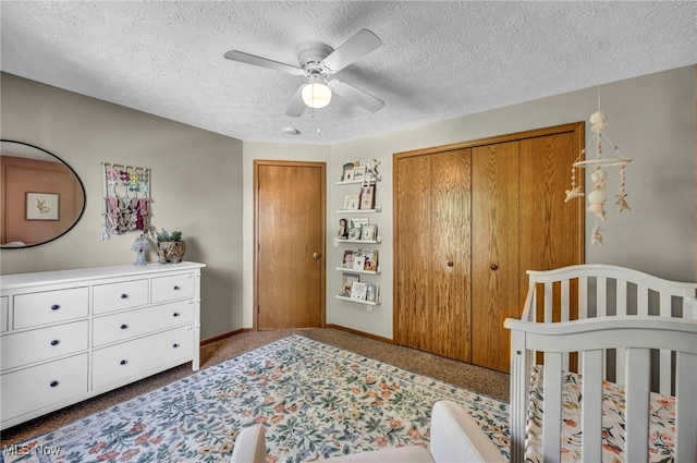 567 Westminster Cir, Akron, OH 44319 - carpeted bedroom featuring a textured ceiling, ceiling fan, and a nursery area