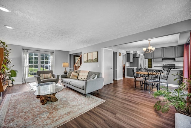 567 Westminster Cir, Akron, OH 44319 - living room featuring a textured ceiling, a chandelier, dark wood-style floors, and recessed lighting