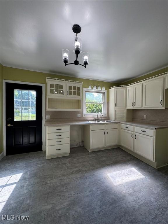 358 N 8th St, Coshocton, OH 43812 - kitchen with a chandelier, white cabinets, decorative light fixtures, and light countertops