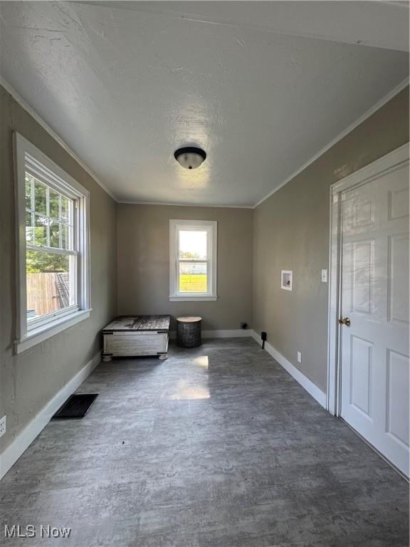 358 N 8th St, Coshocton, OH 43812 - spare room featuring crown molding, wood finished floors, and a textured ceiling