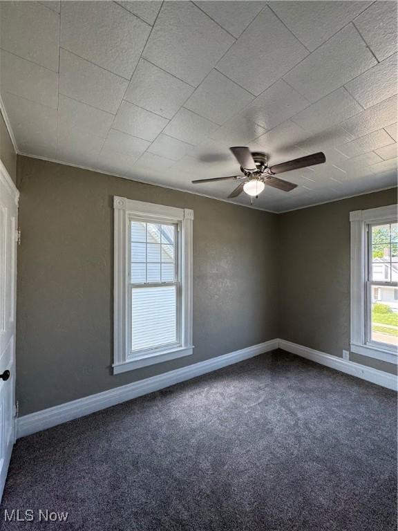 358 N 8th St, Coshocton, OH 43812 - carpeted spare room featuring baseboards and a ceiling fan