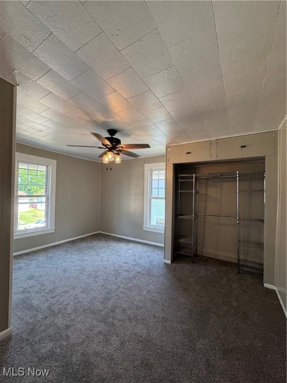 358 N 8th St, Coshocton, OH 43812 - unfurnished bedroom with carpet and ceiling fan